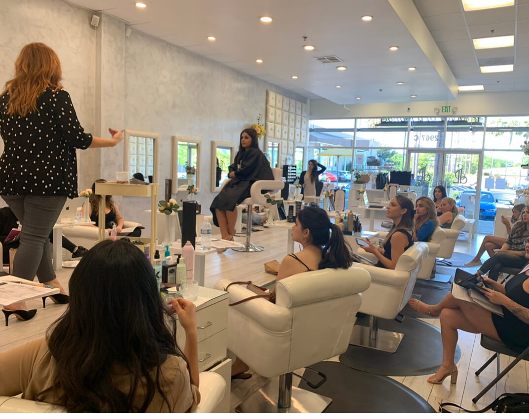 Women learning about salon services